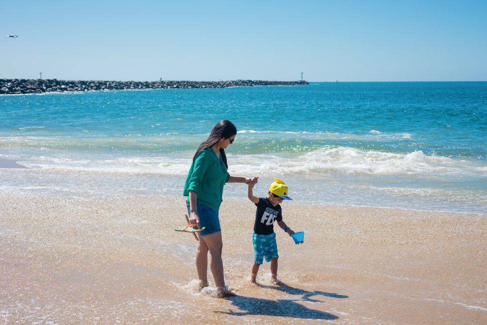 Mom at the beach with her son