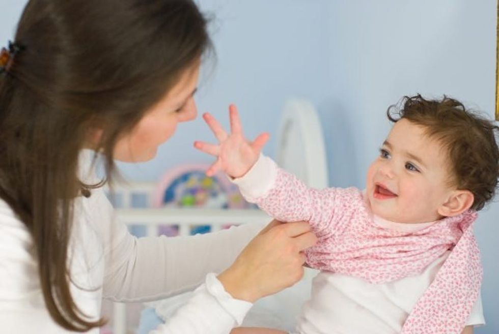 Mom Dressing Daughter