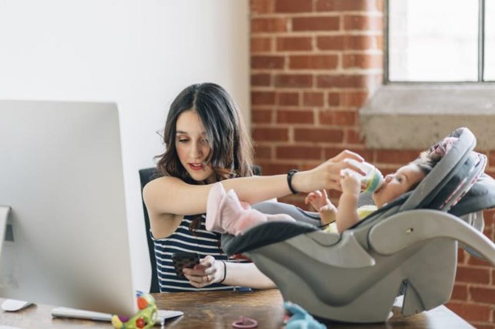 mom working home with baby