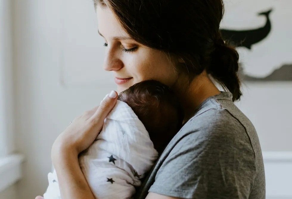 mother holding her baby