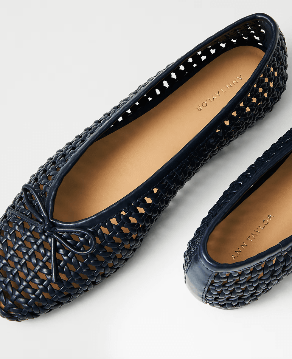 Navy woven ballet flats with a bow detail and tan insoles.
