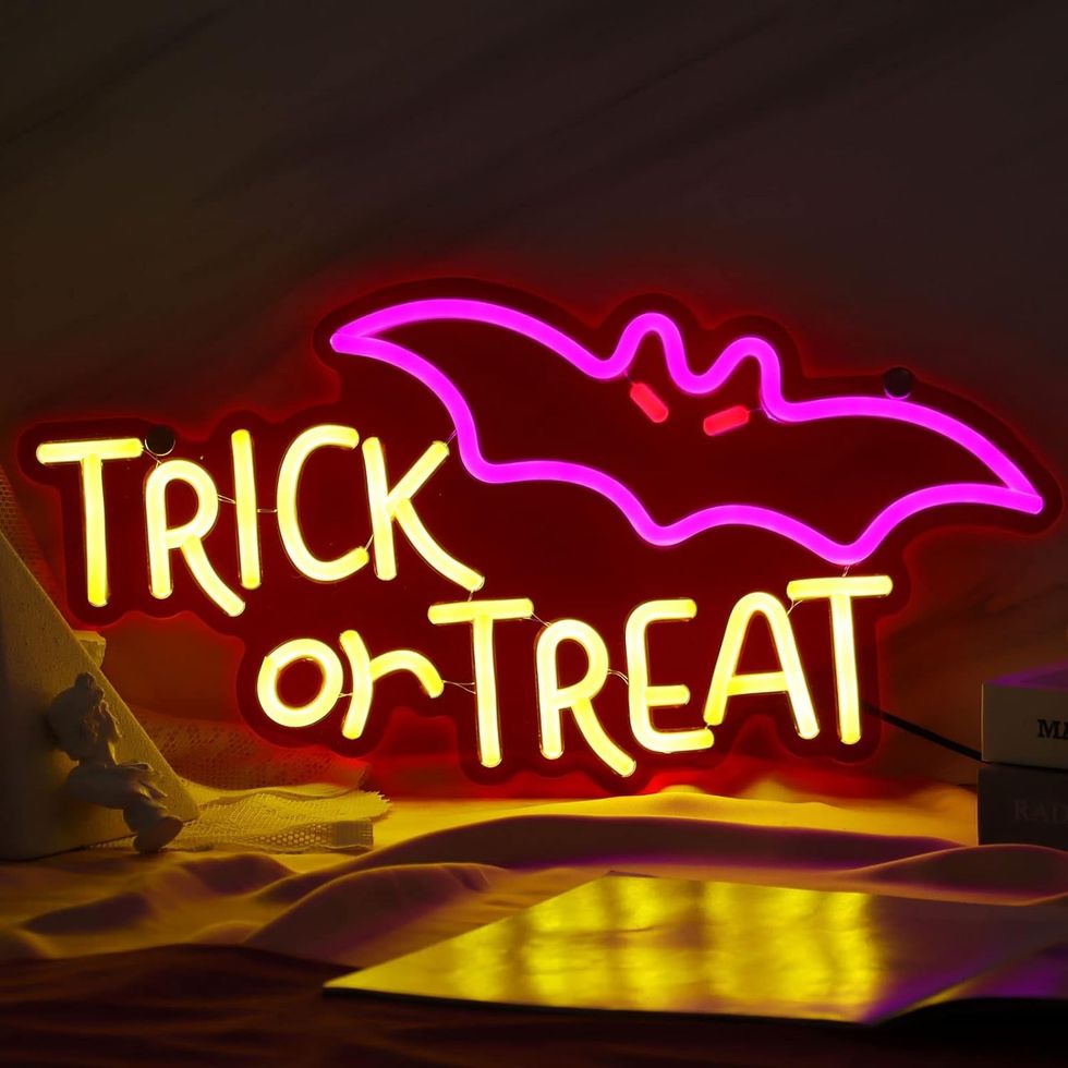 neon trick or treat sign