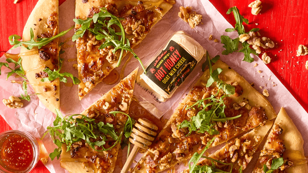 New Trader Joe's items for February 2026 include new spa items like body oil and body scrub, sweet snacks like chocolate biscuit cookies, and cheesy options like dill dip and Unexpected Cheddar Snackers.