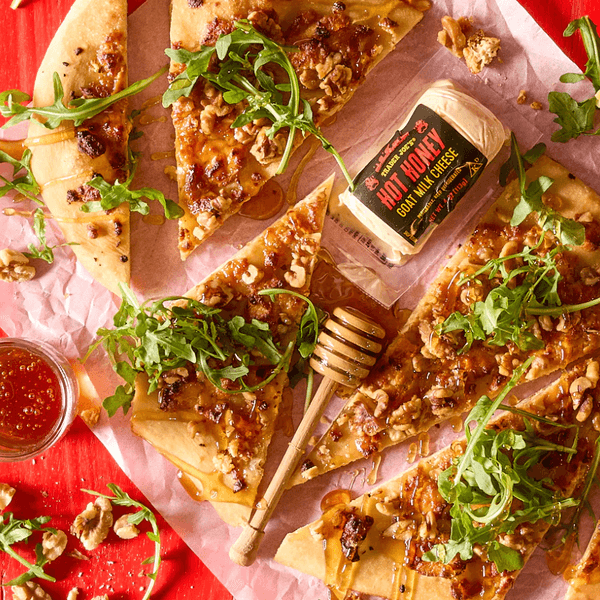 New Trader Joe's items for February 2026 include new spa items like body oil and body scrub, sweet snacks like chocolate biscuit cookies, and cheesy options like dill dip and Unexpected Cheddar Snackers.