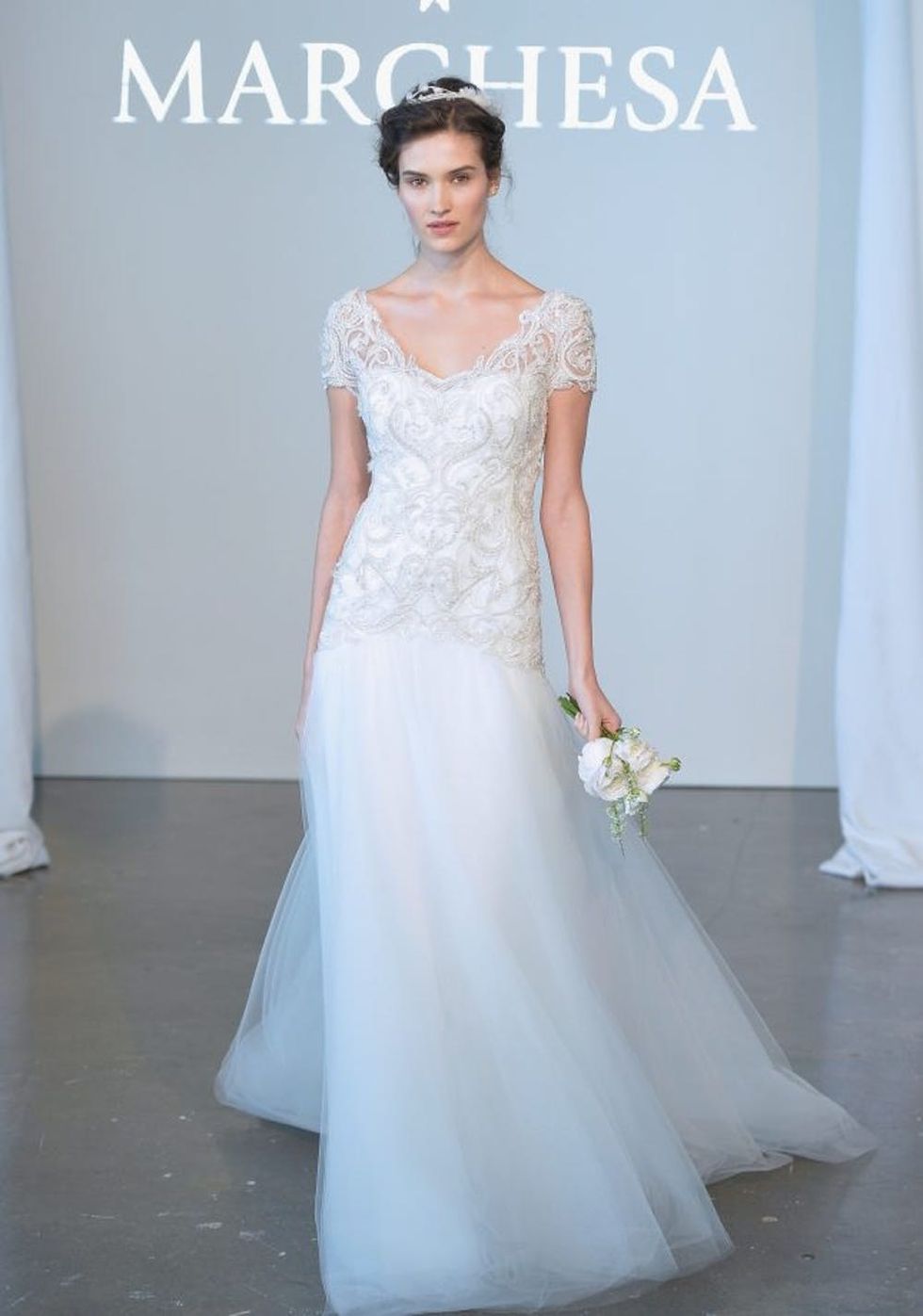NEW YORK, NY - APRIL 11: A model walks the runway during the Marchesa Spring 2015 Bridal collection show at Canoe Studios on April 11, 2014 in New York City. (Photo by Mike Coppola/Getty Images)
