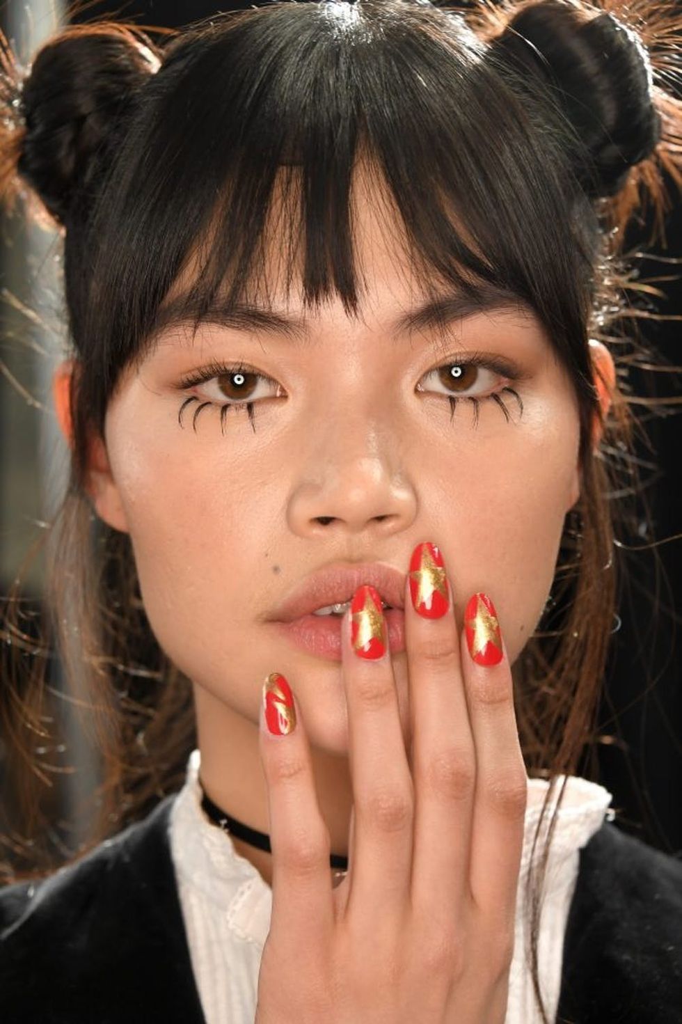 NEW YORK, NY - FEBRUARY 10: A model poses backstage with nails by CND for Jeremy Scott Fall/Winter 2017 on February 10, 2017 in New York City. (Photo by Jennifer Graylock/Getty Images for CND)