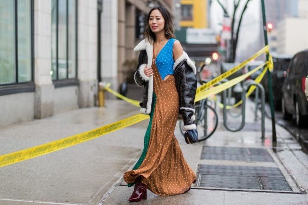 NEW YORK, NY - FEBRUARY 12: Aimee Song wearing a black sheepskin leather jacket, dress with dots outside Diane von Furstenberg on February 12, 2017 in New York City. (Photo by Christian Vierig/Getty Images)