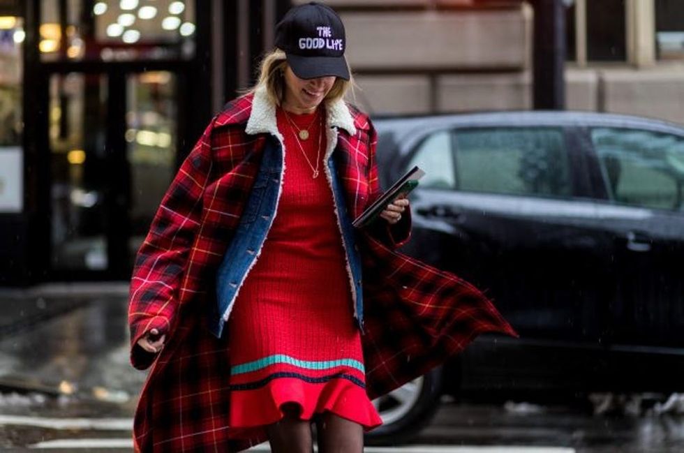 NEW YORK, NY - FEBRUARY 12: Helena Bordon wearing a lumberjack coat, denim jacket, flex cap, red dress outside Victoria Beckham on February 12, 2017 in New York City. (Photo by Christian Vierig/Getty Images)