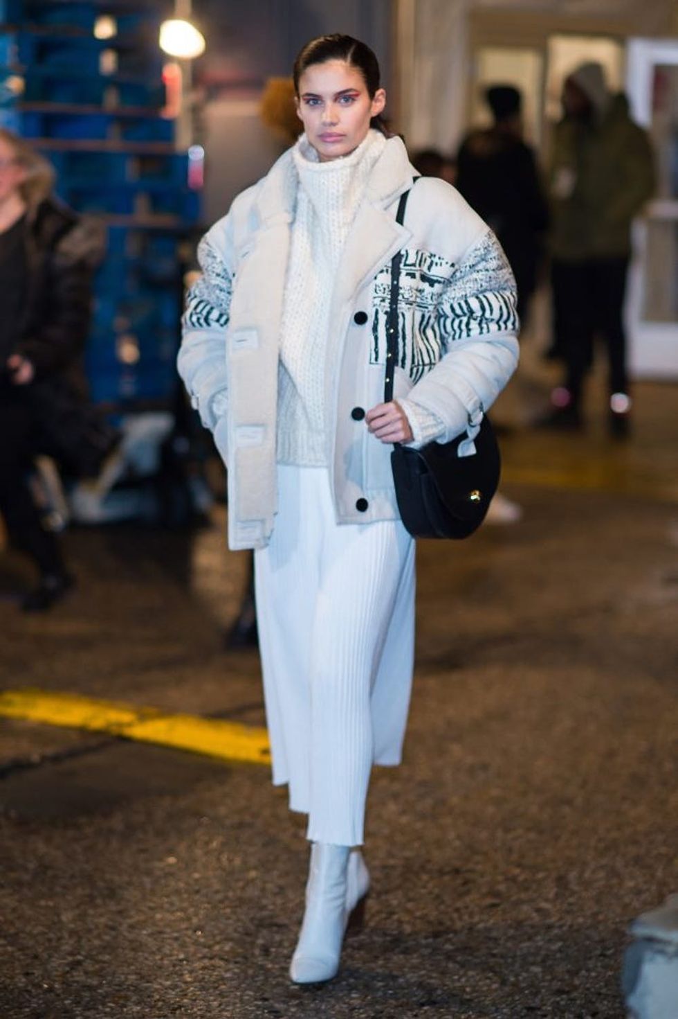 NEW YORK, NY - FEBRUARY 12: Model Sara Sampaio is seen wearing IRO coat, sweater and boots, Adam Lipees dress and Mansur Gavriel bag on February 12, 2017 in New York City. (Photo by Michael Stewart/Getty Images)