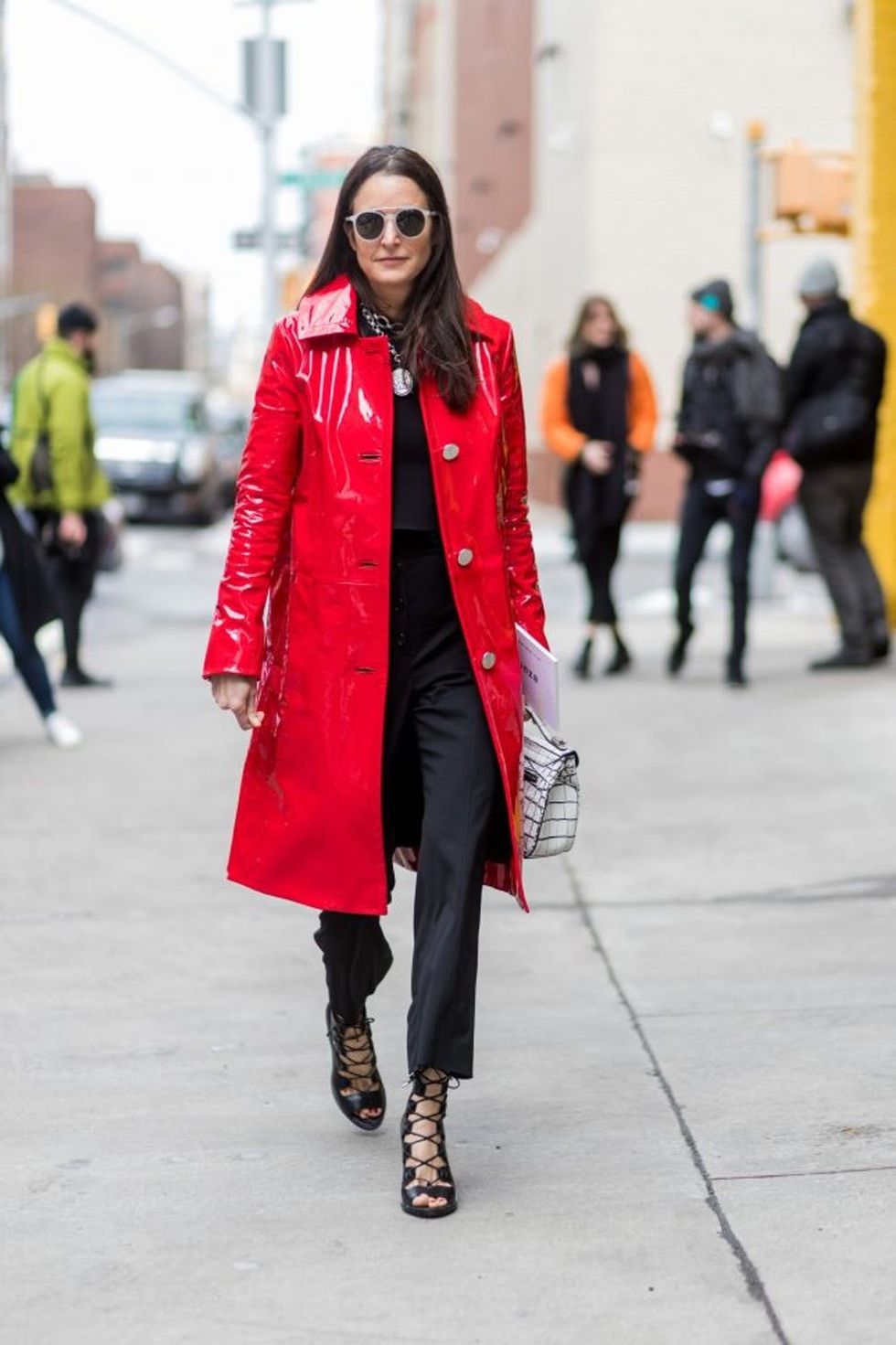 NEW YORK, NY - FEBRUARY 13: A guest wearing a red latex coat outside Proenza Schouler on February 13, 2017 in New York City. (Photo by Christian Vierig/Getty Images)