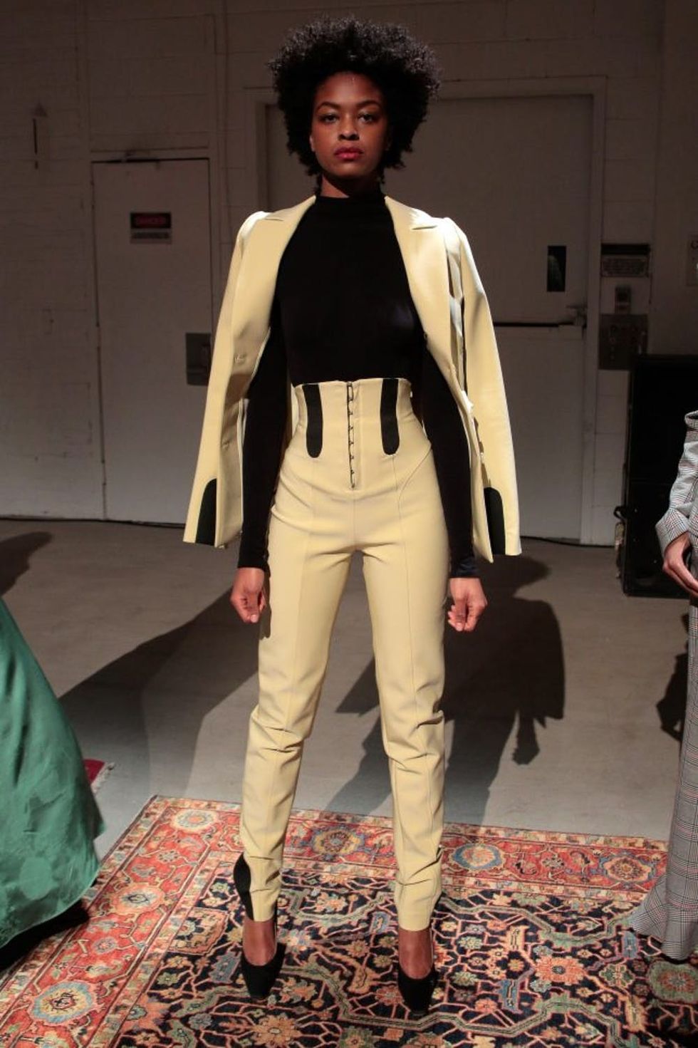 NEW YORK, NY - FEBRUARY 13: A model poses at the Rosie Assoulin Presentation at Gallery 2, Skylight Clarkson Sq on February 13, 2017 in New York City. (Photo by Randy Brooke/WireImage)