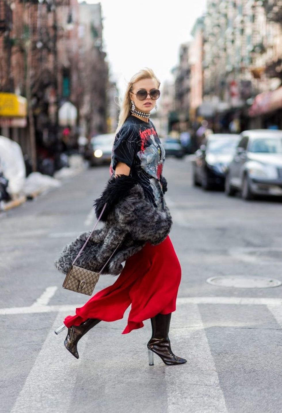 NEW YORK, NY - FEBRUARY 13: Bonnie Strange wearing red flared Zara pants, boots, vintage coat, Gucci bag, Chloe sunglasses, Asos necklace on February 13, 2017 in New York City. (Photo by Christian Vierig/Getty Images)