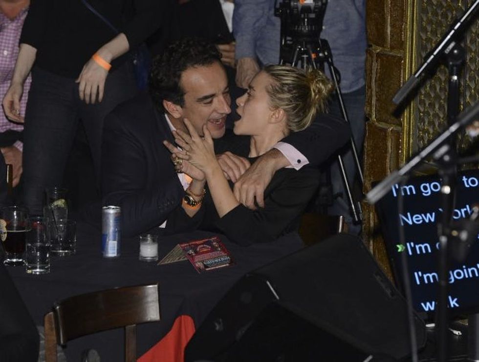 NEW YORK, NY - NOVEMBER 07: Olivier Sarkosy and Mary Kate Olsen attend performance of Ronnie Wood And Mick Taylor With Special Guests at The Cutting Room on November 7, 2013 in New York City. Ronnie Wood of the Rolling Stones made a rare club appearance at New York\u2019s premiere music venue and nightclub, The Cutting Room. Ronnie was performing the music of Jimmy Reed. Musical icons Mick Taylor, Al Cooper, Simon Kirk, Gary Clark Jr. and others joined him on stage. (Photo by Larry Busacca/Getty Images)
