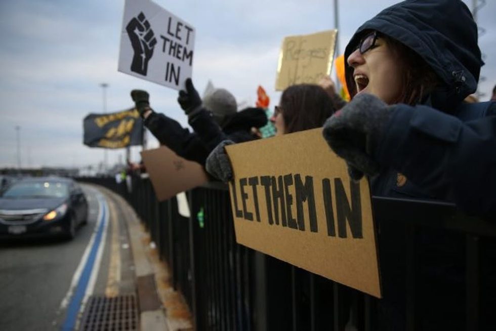 NEW YORK, UNITED STATES - JANUARY 28: Immigration activists stage a protest against President Donald Trump's 90-days ban of entry on 7 Muslim-majority countries in JFK airport in New York, U.S.A on January 28, 2017. (Photo by Mohammed Elshamy/Anadolu Agency/Getty Images)