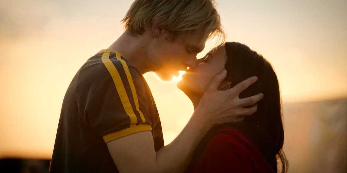 nikki rodriguez and noah lalonde kissing in front of the sunset