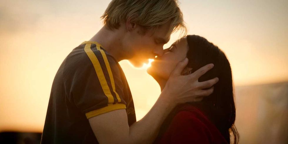 nikki rodriguez and noah lalonde kissing in front of the sunset