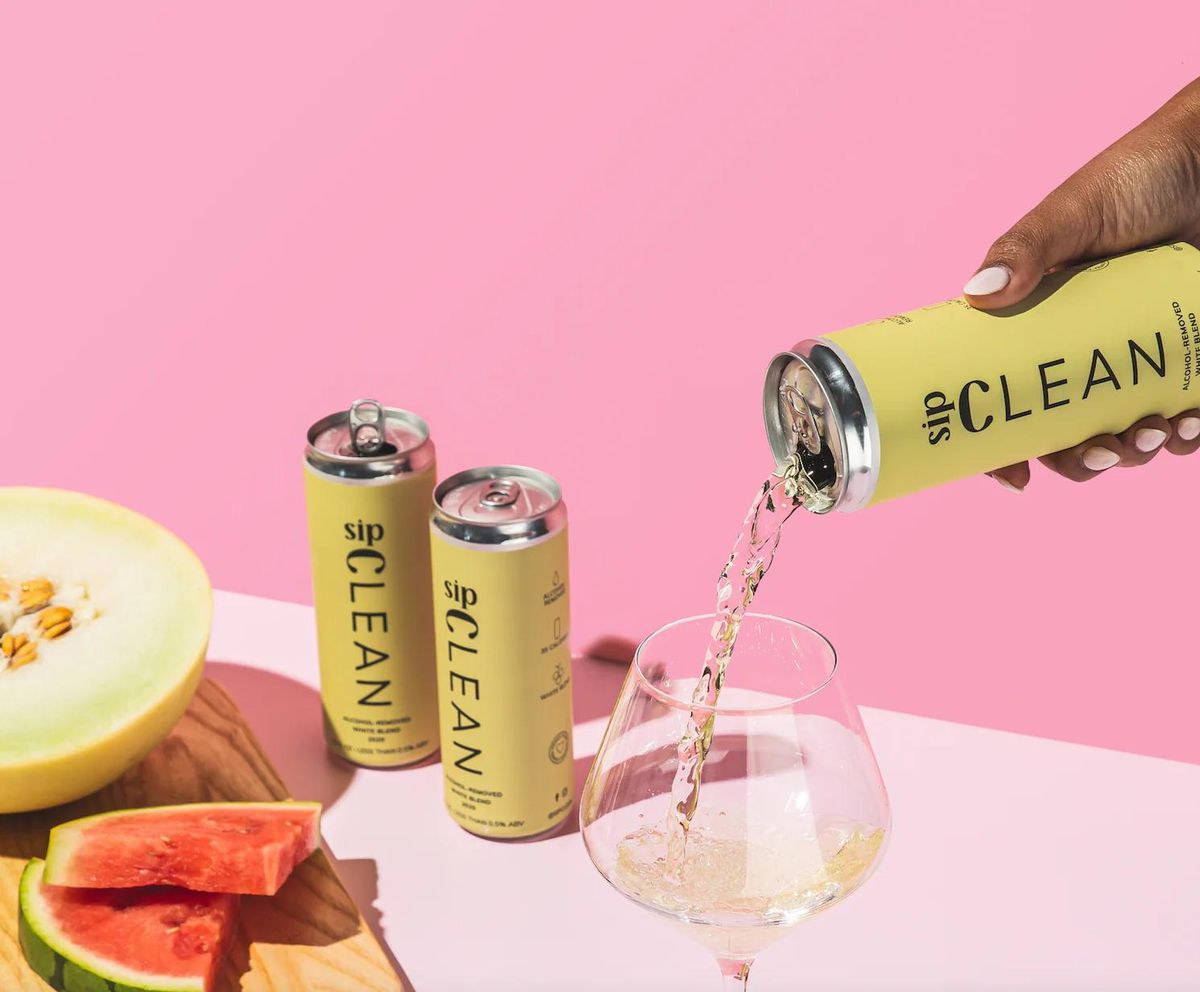 non alcoholic drinks sip clean cans against pink background