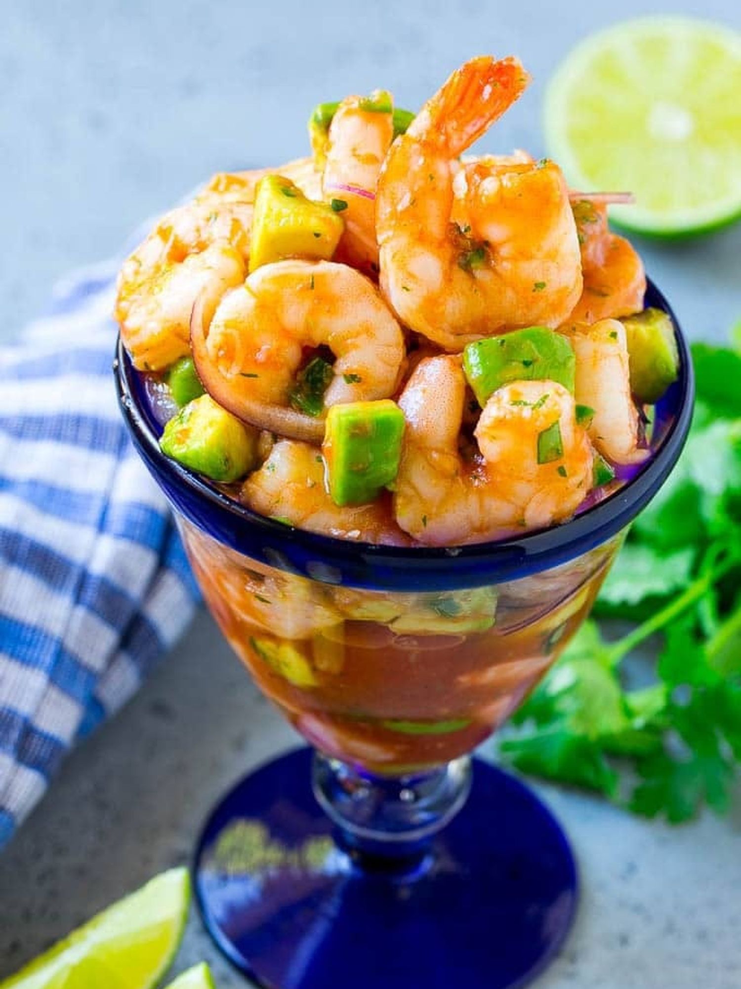 Non-traditional Holiday Appetizer Mexican Shrimp Cocktail in a fancy blue glass