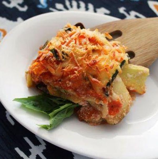noodleless lasagna on a white plate and a colorful napkin