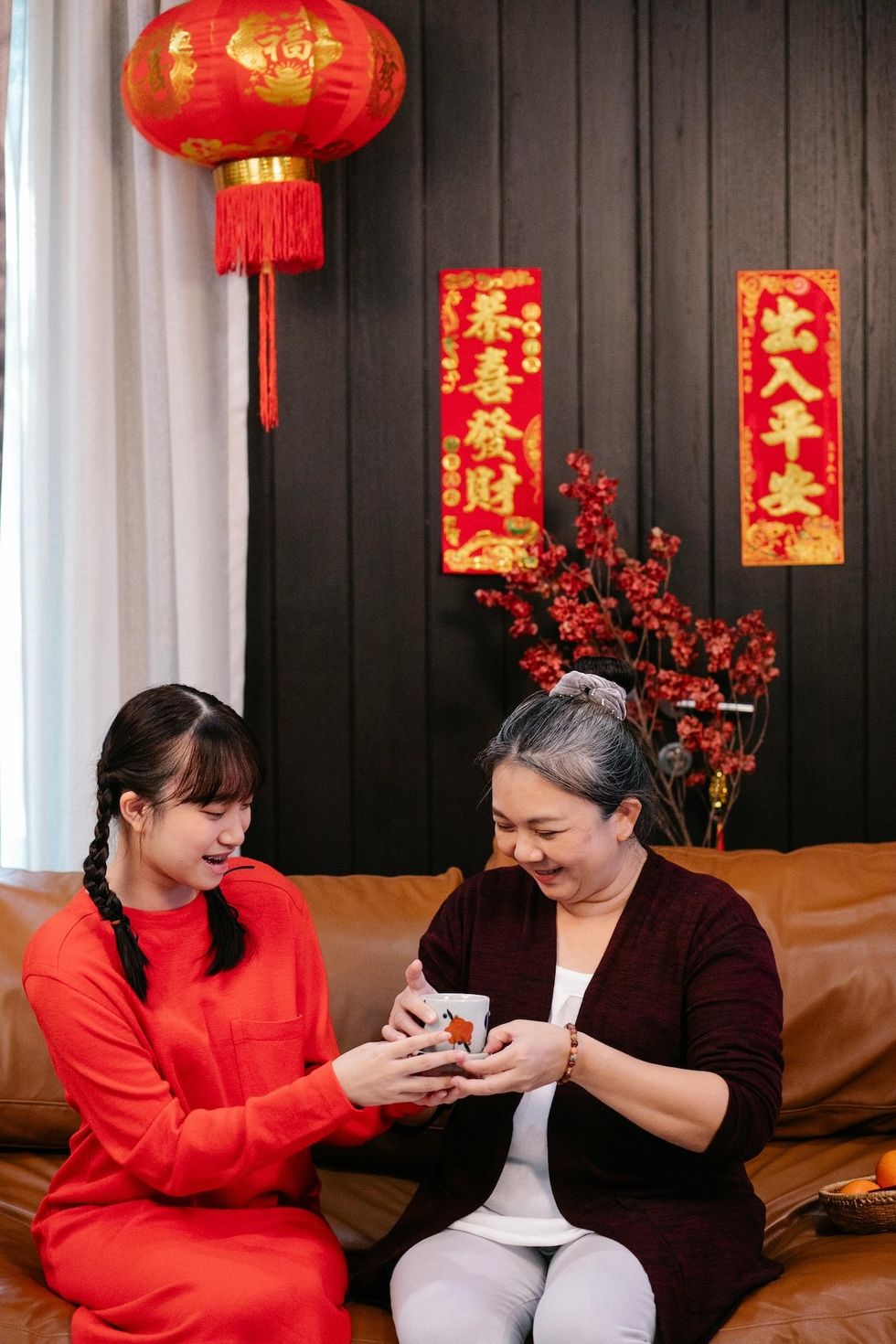 older woman and younger woman drinking tea