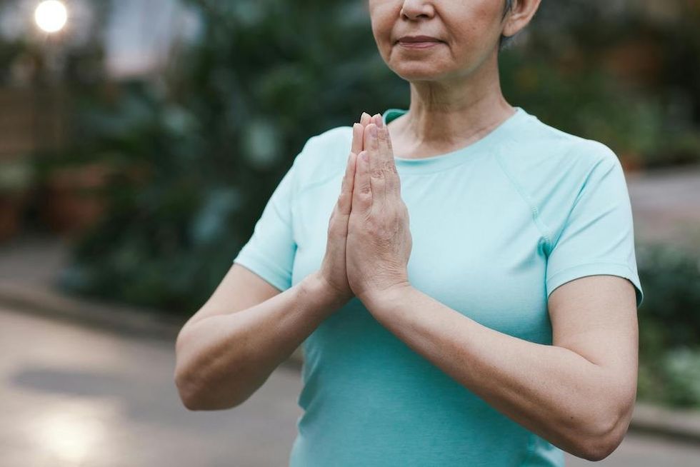 older woman meditating