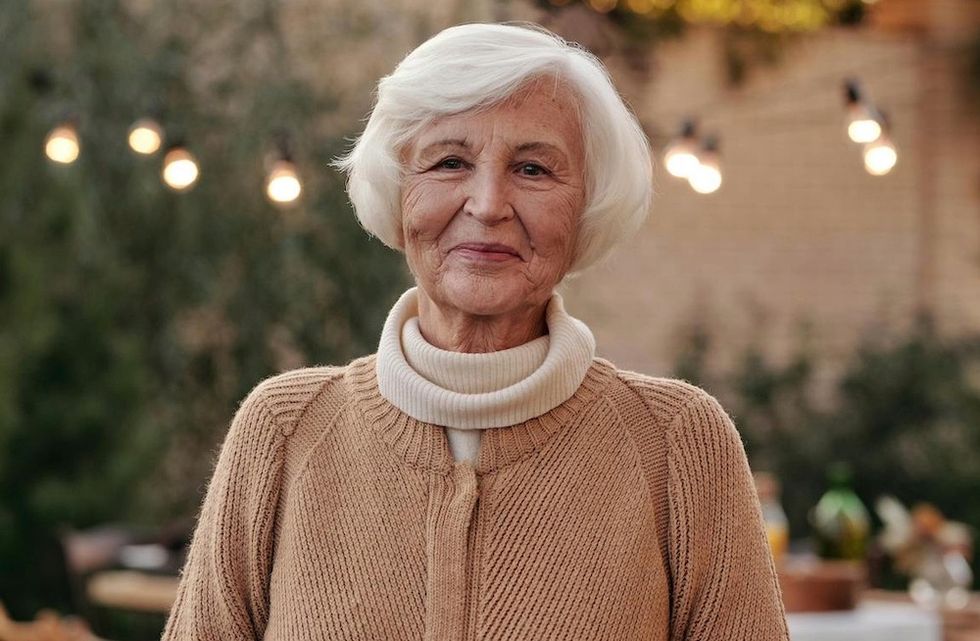 older woman wearing beige