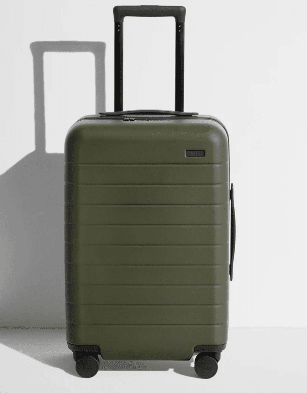 Olive green hard-shell suitcase with black telescopic handle and four wheels.