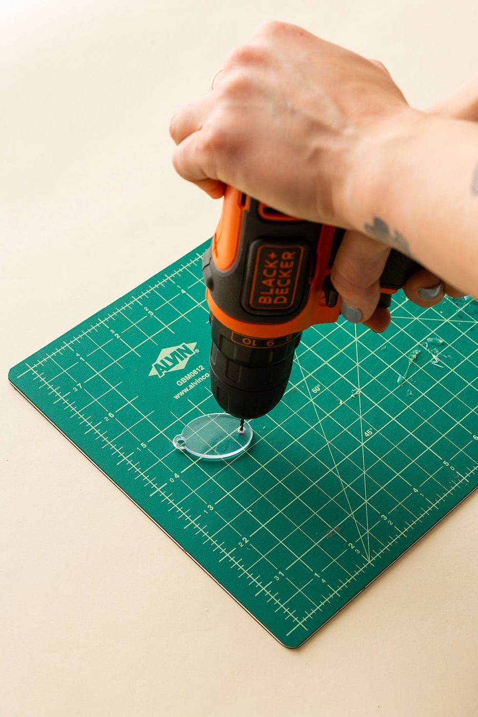 orange and black drill drill a hole in to the clear acrylic earring