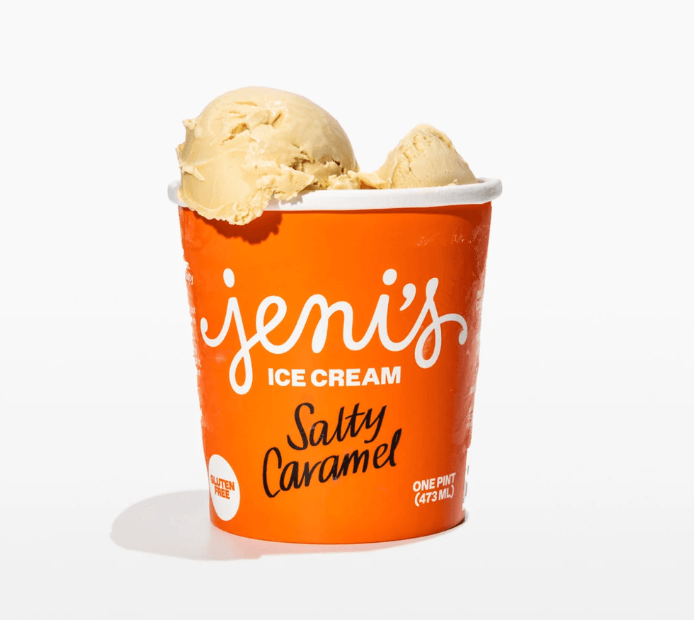Orange tub of Salty Caramel ice cream with two scoops on top.