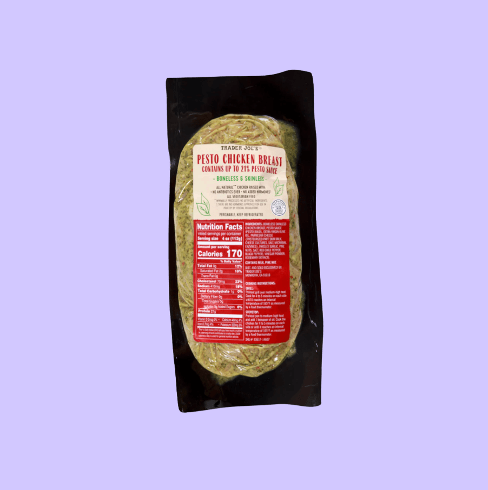 Packaged pesto chicken breast with nutrition label, on a light purple background.