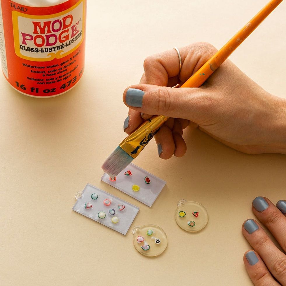 paint mod podge on top of the fruit on the earring