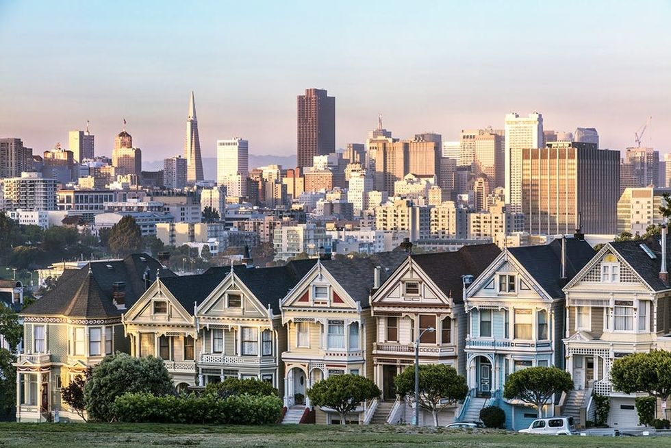 Painted ladies and skyline at sunset, San Francisco, California, USA
