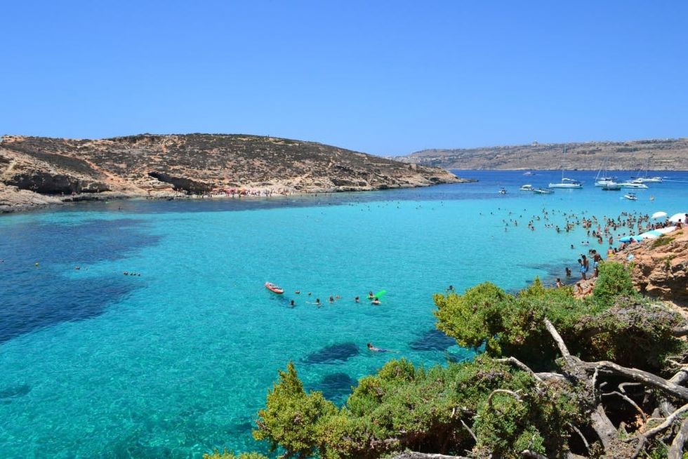 Paradise Bay glows a vivid blue