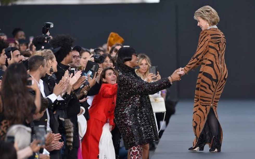 PARIS, FRANCE - OCTOBER 01: Jane Fonda greets Naomi Campbell on the runway during Le Defile L'Oreal Paris as part of Paris Fashion Week Womenswear Spring/Summer 2018 at Avenue Des Champs Elysees on October 1, 2017 in Paris, France. (Photo by Kristy Sparow/Getty Images for L'Oreal)