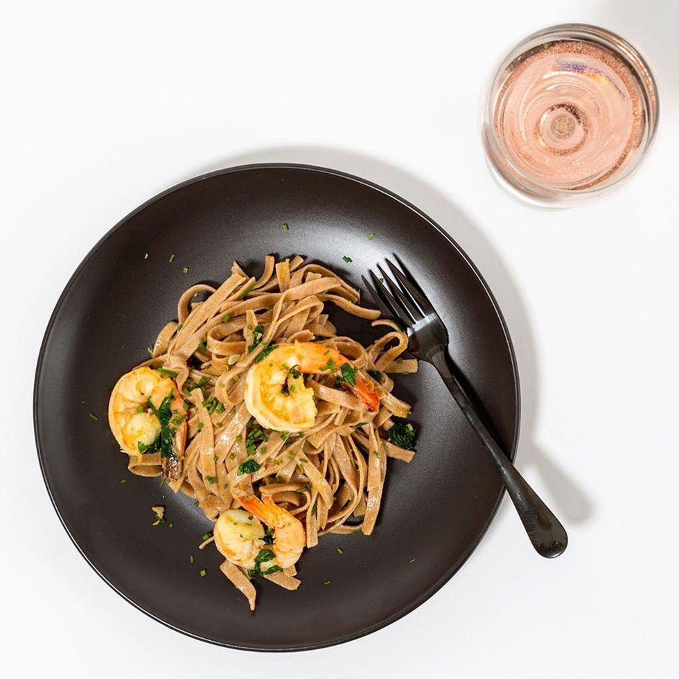 pasta meal on a black plate