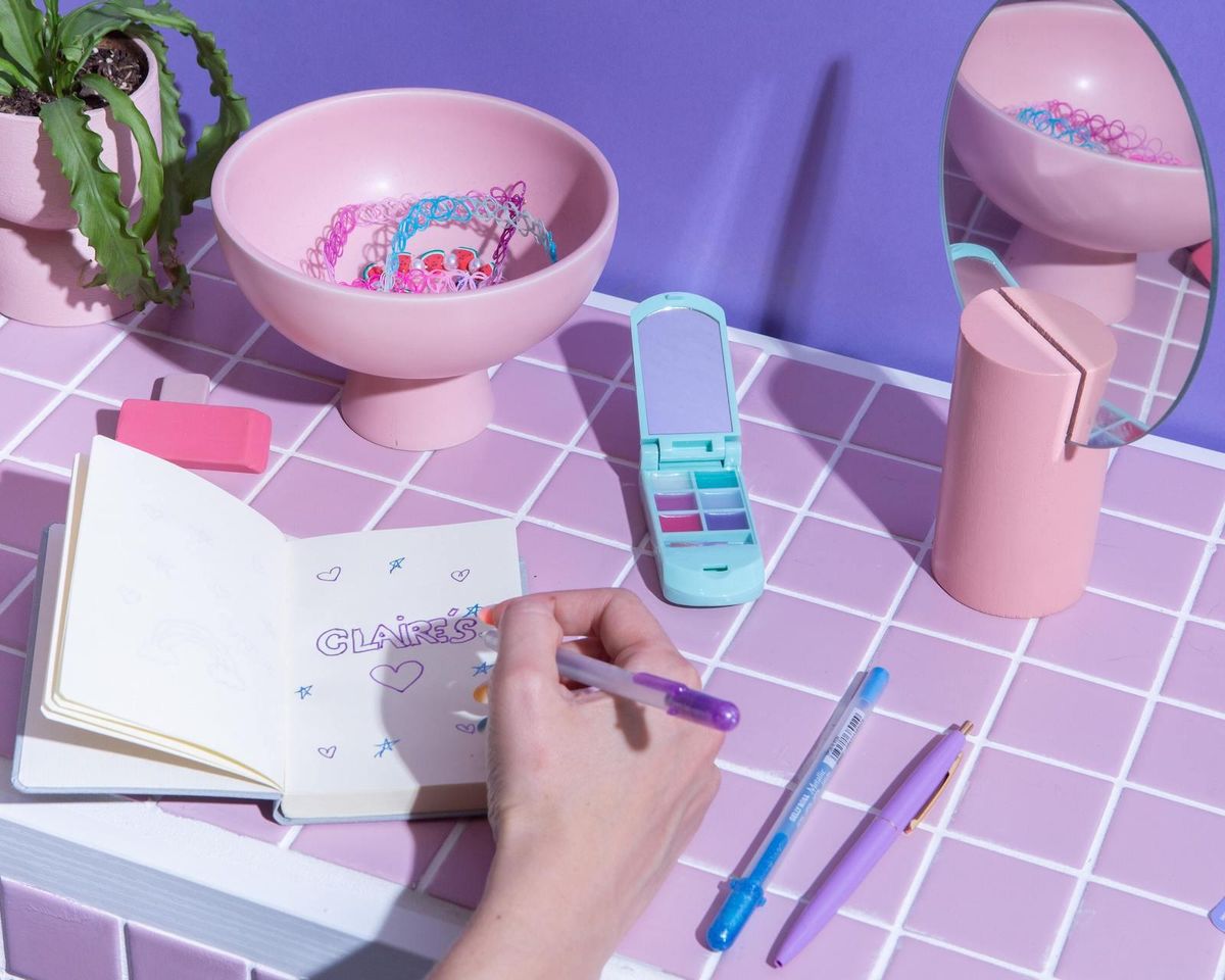 pastel pinks purples and blues writing in diary 90s toys
