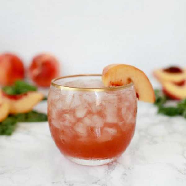 Peach-Basil Shrub Cocktail with peach slice