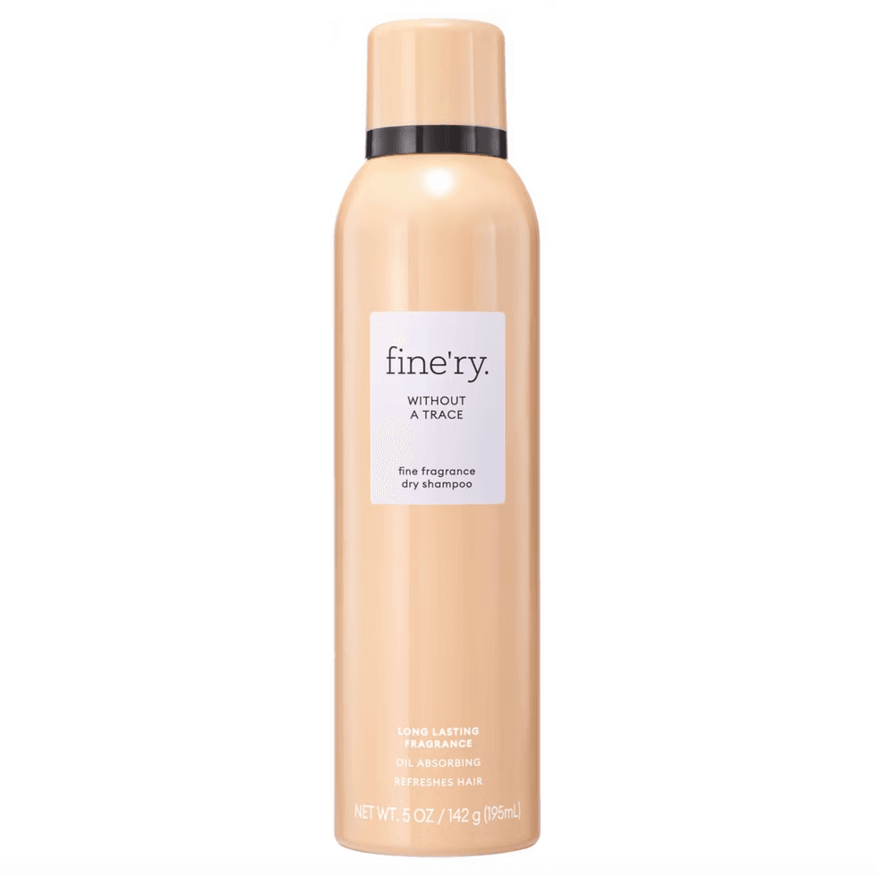 Peach-colored dry shampoo bottle labeled "fine'ry Without a Trace."