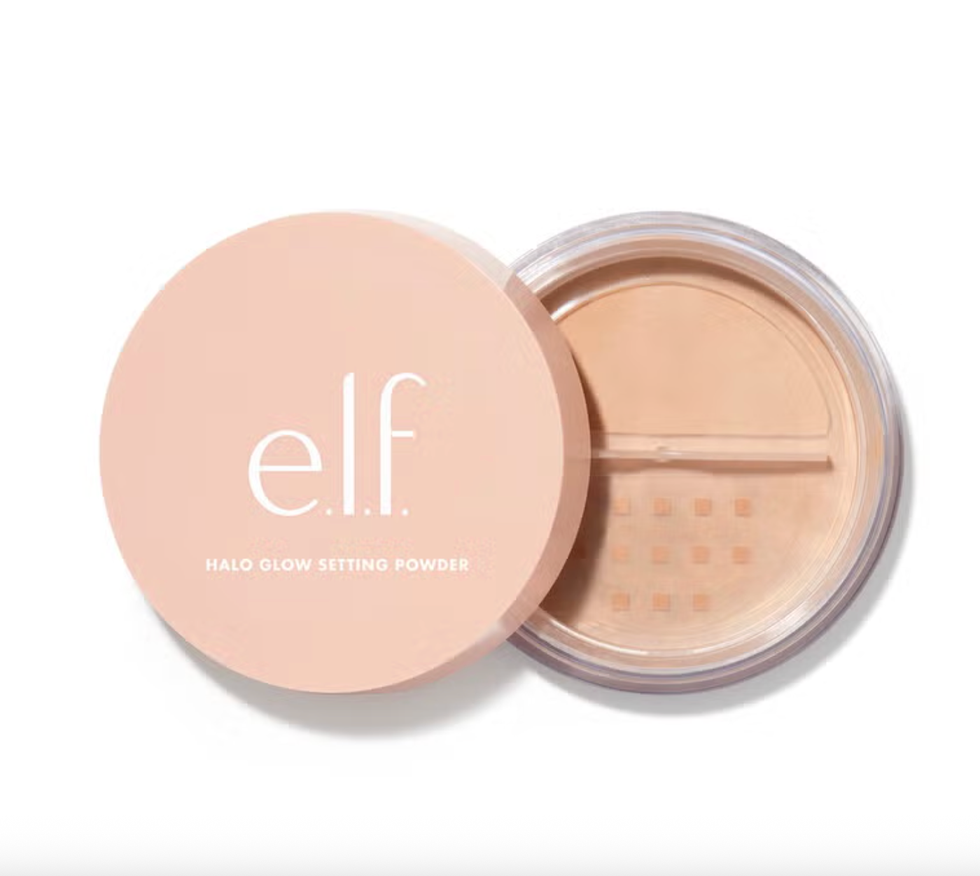 Peach-colored e.l.f. Halo Glow Setting Powder with an open lid on a white background.