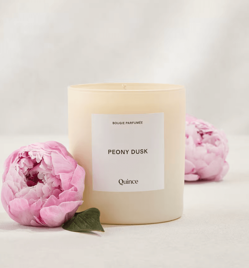 Peony Dusk candle by Quince, with pink peonies on a soft background.