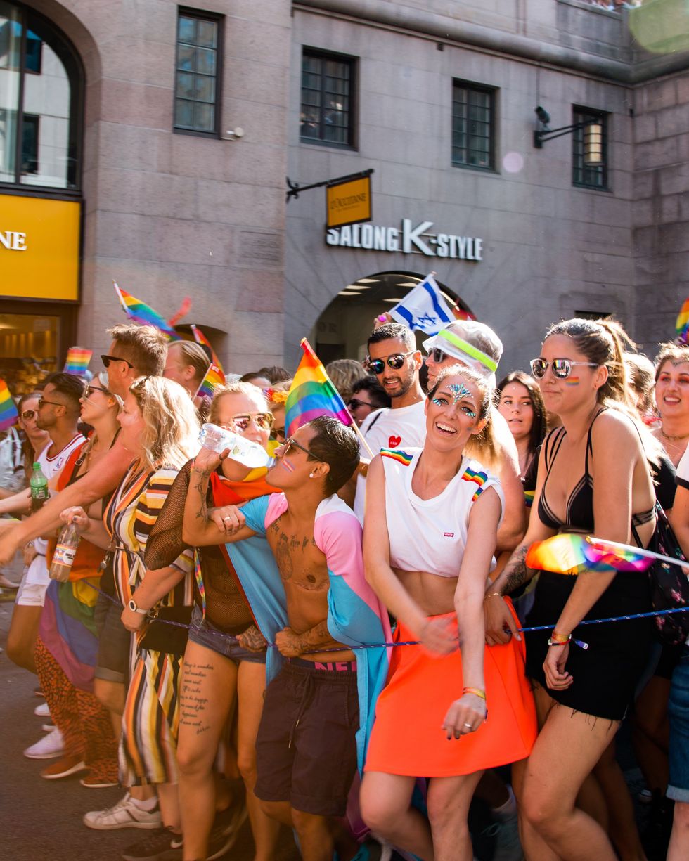 people lined up at a pride parade