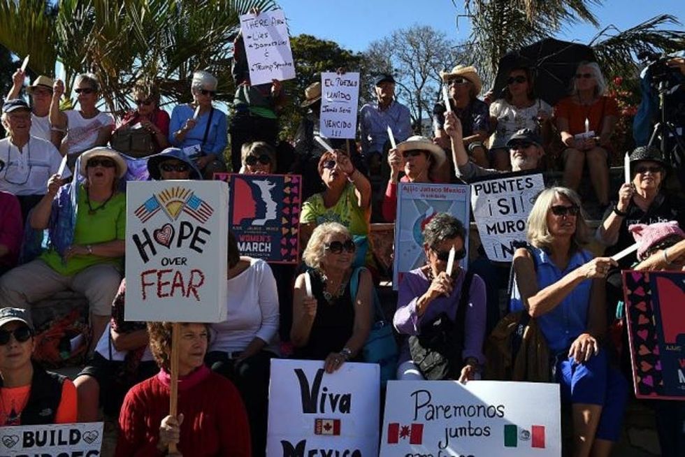 People take part in the "Women's March" in Ajijic -a city with a large community of US and Canandian nationals, mainly retired-, Jalisco state, Mexico on January 21, 2017. The rally took place in solidarity with the Women's March summoned in the United States one day after the inauguration of President Donald Trump. / AFP / HECTOR GUERRERO (Photo credit should read HECTOR GUERRERO/AFP/Getty Images)