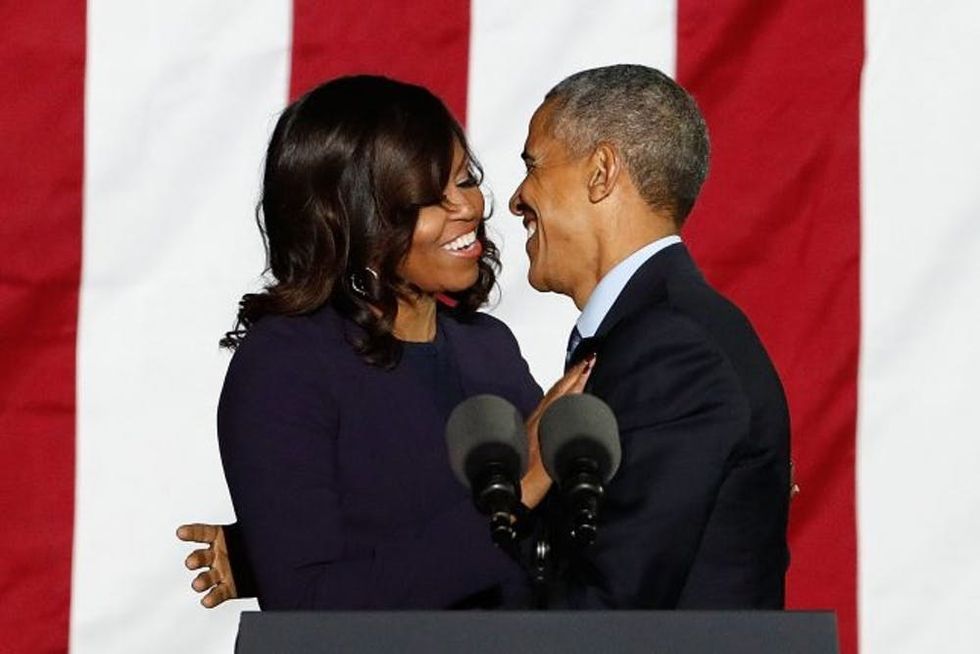 PHILADELPHIA, PA - NOVEMBER 07: Michelle Obama and Barack Obama embrace during "The Night Before" campaign rally at Independence Hall on November 7, 2016 in Philadelphia, Pennsylvania. (Photo by Taylor Hill/WireImage)