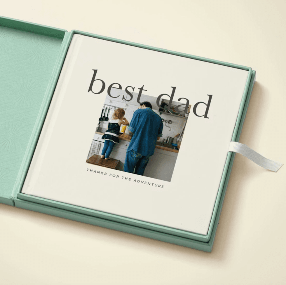 Photo book titled "Best Dad" with a kitchen scene on the cover.