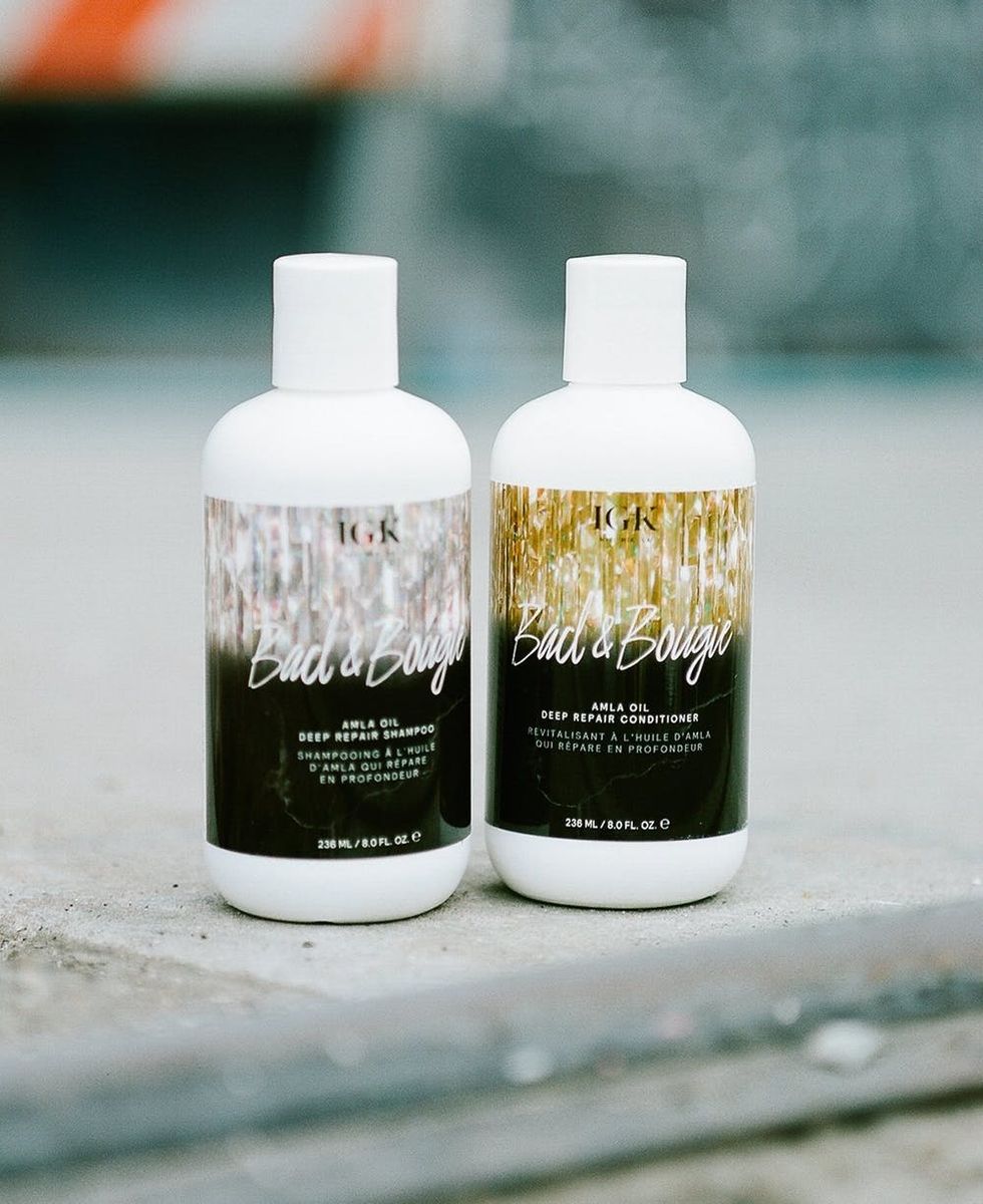 Picture of IGK Bad & Bougie Shampoo and Conditioner on a street corner.