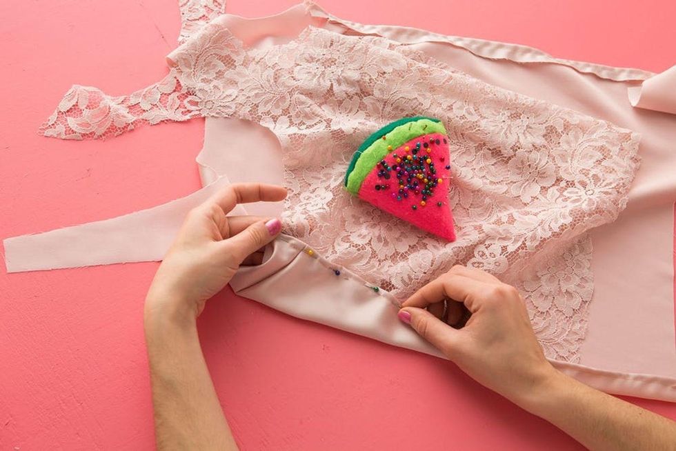 pin the lace on the front of the satin