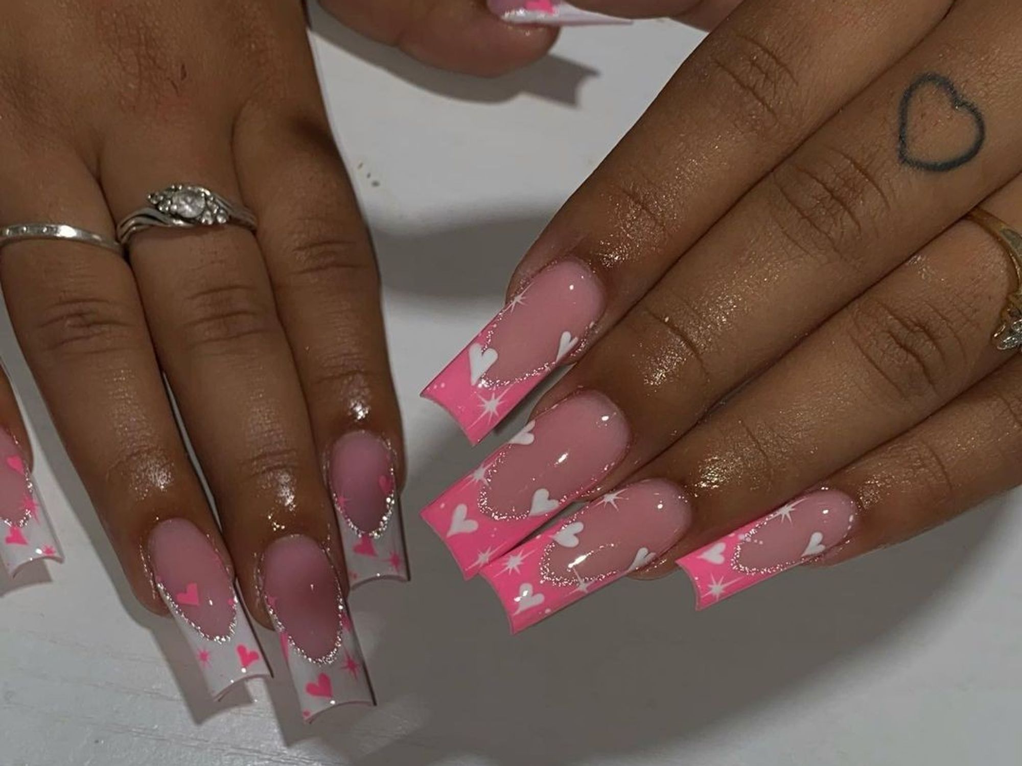 pink and white french manicure with pink and white hearts