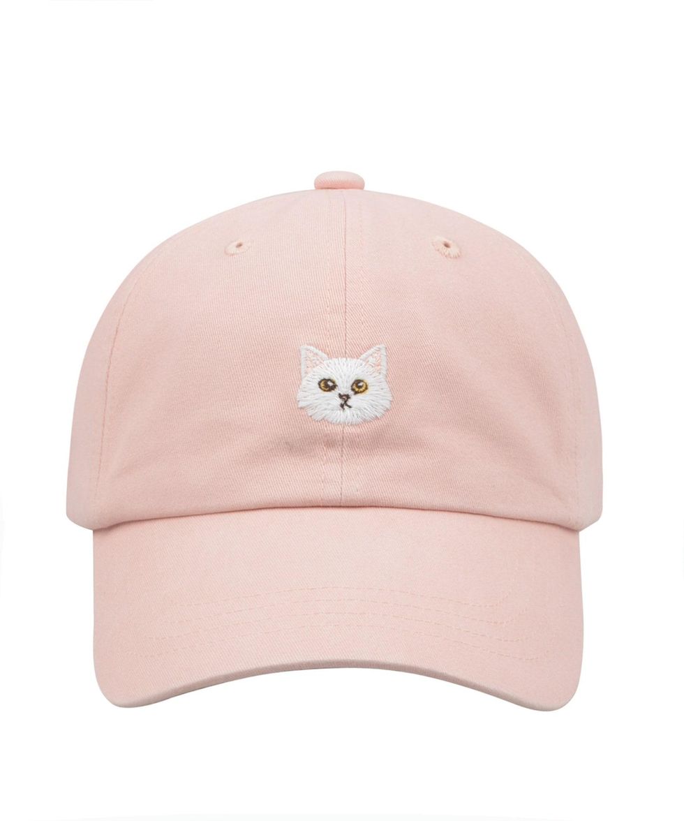 pink ball cap with a cat on the front