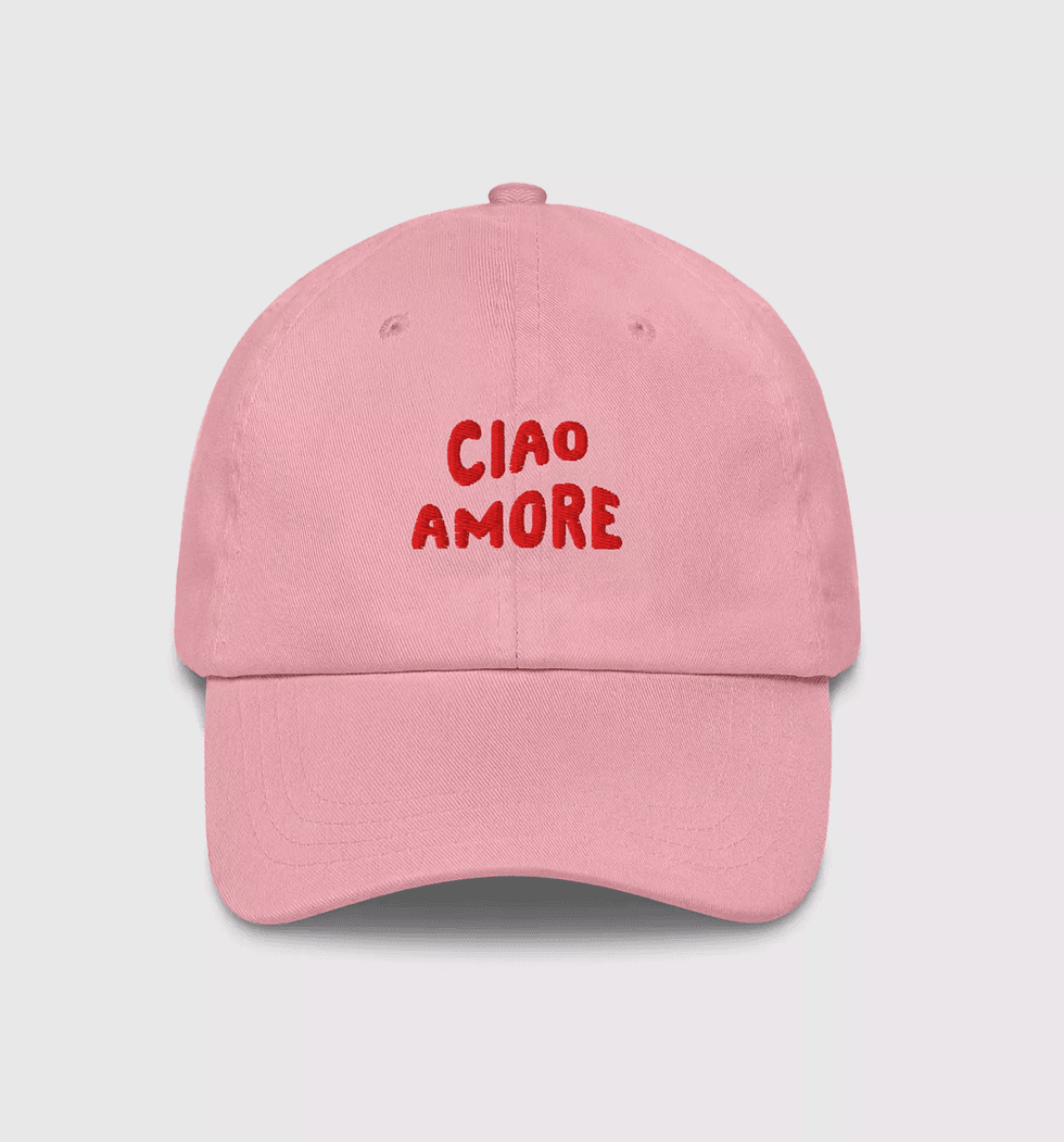 Pink cap with "CIAO AMORE" in red text on the front.