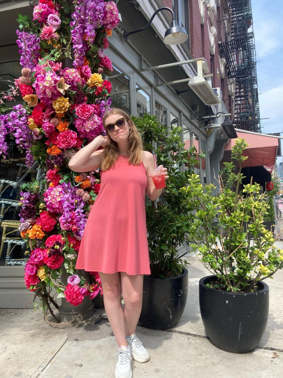 pink dress and pink drink with a flower background